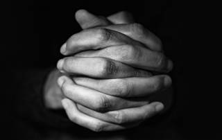 Hands folded in faith