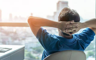 Man Looking Out of Window