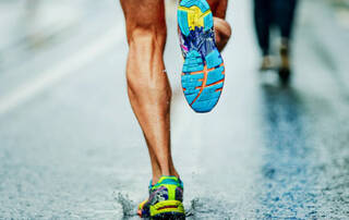 Marathon Runner in Rain